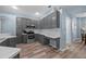 Spacious kitchen featuring stainless steel appliances, gray cabinetry, and modern countertops at 3725 Grand Forks Dr, Land O Lakes, FL 34639