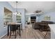 Open concept with wood floors and a fireplace, offers a seamless flow for modern living at 3725 Grand Forks Dr, Land O Lakes, FL 34639
