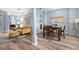 Inviting living room with modern furnishings, stylish decor, and wood-look flooring at 3725 Grand Forks Dr, Land O Lakes, FL 34639