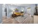 Welcoming living area with hardwood flooring, comfortable seating, and an open layout at 3725 Grand Forks Dr, Land O Lakes, FL 34639