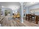 Comfortable living space featuring wood-look floors, light blue walls, and a view of the backyard at 3725 Grand Forks Dr, Land O Lakes, FL 34639