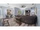 Bright living room boasts wood floors, a fireplace, and a large sofa, perfect for relaxing or entertaining at 3725 Grand Forks Dr, Land O Lakes, FL 34639