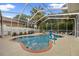 Screened-in pool and hot tub offer an ideal space for relaxation and entertainment featuring a basketball hoop at 3725 Grand Forks Dr, Land O Lakes, FL 34639
