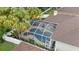 Aerial view features a screened-in pool with palm trees and a well maintained patio area at 3725 Grand Forks Dr, Land O Lakes, FL 34639
