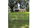 Fenced in backyard with grass and barn at 4106 Old Mulberry Rd, Plant City, FL 33567