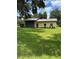 Barn on a grassy lawn with mature trees at 4106 Old Mulberry Rd, Plant City, FL 33567