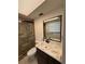 Neutral bathroom featuring a tiled shower with glass door, vanity with solid surface counter and modern fixtures at 4106 Old Mulberry Rd, Plant City, FL 33567