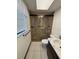 Bathroom featuring a tiled walk-in shower, modern fixtures, and neutral tones for a clean and stylish design at 4106 Old Mulberry Rd, Plant City, FL 33567