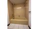 Bathroom features a yellow tiled tub with a shower head and towel rack at 4106 Old Mulberry Rd, Plant City, FL 33567