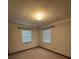 Bedroom shows carpet, white walls, and two windows with blinds at 4106 Old Mulberry Rd, Plant City, FL 33567