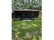 Inviting screened-in front porch with neutral exterior and well-maintained landscaping for relaxing outdoors at 4106 Old Mulberry Rd, Plant City, FL 33567
