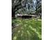 Charming brick home with well-manicured lawn and mature trees at 4106 Old Mulberry Rd, Plant City, FL 33567