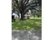 A quaint garage with a red roof adds to the charm of this property at 4106 Old Mulberry Rd, Plant City, FL 33567