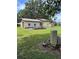 Large garage with a red roof and ample space at 4106 Old Mulberry Rd, Plant City, FL 33567