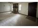 Spacious living room featuring a stone fireplace, ceiling fan, and front door at 4106 Old Mulberry Rd, Plant City, FL 33567