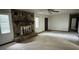 Spacious living room featuring a stone fireplace, ceiling fan, and access door at 4106 Old Mulberry Rd, Plant City, FL 33567