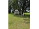 Cozy shed surrounded by lush greenery and mature trees at 4106 Old Mulberry Rd, Plant City, FL 33567