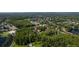Overhead shot of a community surrounded by green trees and beautiful lakes at 4117 Daventry Ln, Palm Harbor, FL 34685