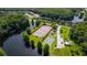 Aerial view of community amenities, including tennis courts, a basketball court, and a playground at 4117 Daventry Ln, Palm Harbor, FL 34685