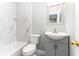 Bathroom featuring a tub with marble-style tile, and a modern vanity at 4117 Daventry Ln, Palm Harbor, FL 34685