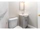 Bathroom featuring a toilet, and a modern vanity with storage at 4117 Daventry Ln, Palm Harbor, FL 34685