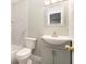 Bathroom featuring a toilet, a tub with marble-style tile, and modern vanity at 4117 Daventry Ln, Palm Harbor, FL 34685