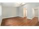A light bedroom features hardwood floor, high ceiling, ceiling fan, skylight and attached bathroom at 4117 Daventry Ln, Palm Harbor, FL 34685