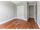 Bedroom with hardwood floors and closet at 4117 Daventry Ln, Palm Harbor, FL 34685