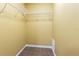 Walk-in closet featuring tile flooring and storage racks at 4117 Daventry Ln, Palm Harbor, FL 34685