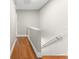 Hallway with hardwood floors and neutral paint at 4117 Daventry Ln, Palm Harbor, FL 34685