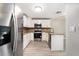 View of stainless steel appliances, granite countertops, and white cabinets in updated kitchen at 4117 Daventry Ln, Palm Harbor, FL 34685