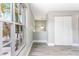 Bright, open living room with a large window for natural light and wood-look vinyl flooring at 4117 Daventry Ln, Palm Harbor, FL 34685