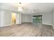 Expansive main bedroom with light grey vinyl flooring and sliding door to screened porch at 4117 Daventry Ln, Palm Harbor, FL 34685