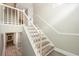 Beautiful staircase with wooden steps, white risers and banister, plus stylish trim at 4117 Daventry Ln, Palm Harbor, FL 34685