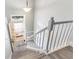 Staircase showcasing an open doorway with a view to the outside, providing natural light at 4117 Daventry Ln, Palm Harbor, FL 34685