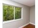Window with a view of trees and foliage at 4117 Daventry Ln, Palm Harbor, FL 34685