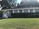 Charming single-story home with well-maintained lawn and a tidy shrubbery at 4209 E Hanna Ave, Tampa, FL 33610