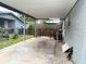 Covered patio area, with bar stools, offering an outdoor space for dining or relaxation at 4209 E Hanna Ave, Tampa, FL 33610