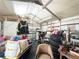 View inside the storage shed filled with tires, furniture, and other items at 4209 E Hanna Ave, Tampa, FL 33610