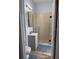 Bathroom featuring a glass-enclosed shower, modern vanity, and wood-look flooring at 4217 Balington Dr, Valrico, FL 33596