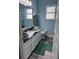 Bathroom featuring a dark granite countertop, white cabinets, and modern fixtures at 4217 Balington Dr, Valrico, FL 33596