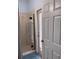 Bathroom with a glass shower door and direct access to the exterior at 4217 Balington Dr, Valrico, FL 33596