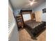 Bedroom featuring a Murphy bed, side shelves, and light blue walls at 4217 Balington Dr, Valrico, FL 33596