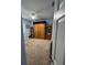 This bedroom shows a Murphy bed system with built in shelves and lots of carpeted floor space at 4217 Balington Dr, Valrico, FL 33596