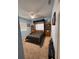 Bedroom with carpet floors, ceiling fan and bookshelves near a Murphy bed at 4217 Balington Dr, Valrico, FL 33596