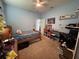 Bedroom featuring a bed, desk, and blue walls with shelving decor at 4217 Balington Dr, Valrico, FL 33596