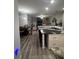 Open concept living space including the kitchen, dining area, and living room. The space is great for entertaining at 4217 Balington Dr, Valrico, FL 33596