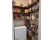 Well-stocked pantry with wooden shelving and a chest freezer for ample food storage at 4217 Balington Dr, Valrico, FL 33596