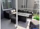 The covered patio features a conversation area with a wicker sectional and a fire pit table at 4217 Balington Dr, Valrico, FL 33596