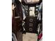 Organized walk-in closet featuring built-in shelving and drawers for optimal storage and organization at 4217 Balington Dr, Valrico, FL 33596